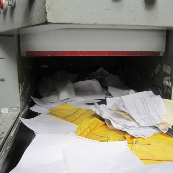 papers entering into paper shredder